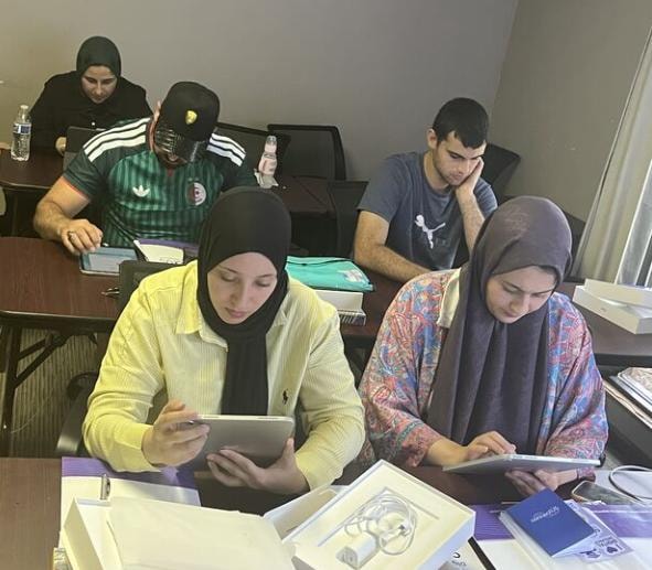 Students studying with tablets in class